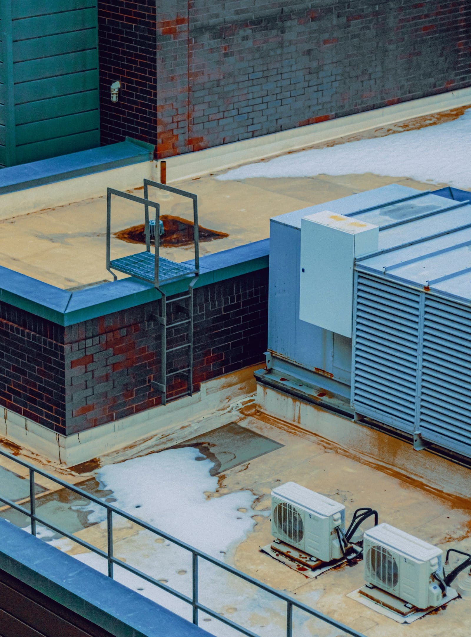 Rooftop HVAC cooling towers and mechanical units on a building exterior